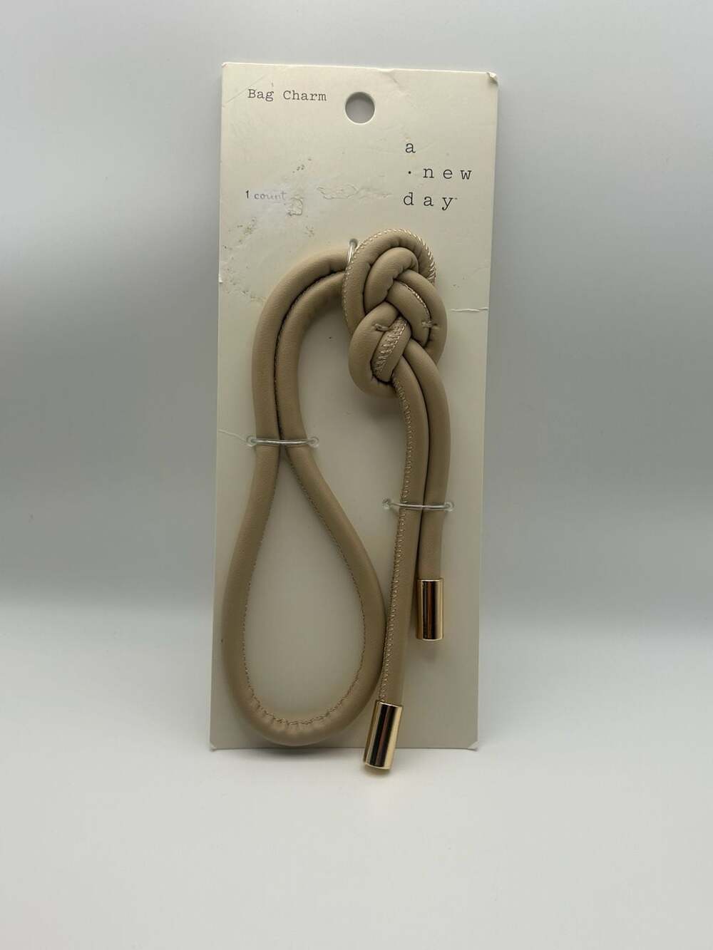 A New Day Tubular Strap Knot Bag Charm in Tan